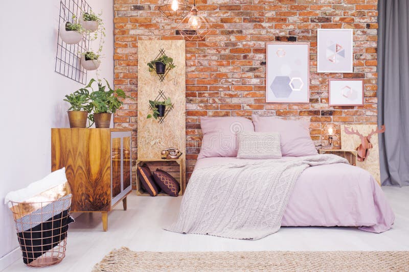 Bedroom with OSB decoration. Industrial bedroom with bed and diy OSB decoration royalty free stock images